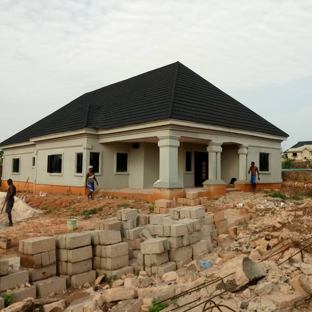 The same four-bedroom bungalow during construction, before the exterior finishes and paving were completed